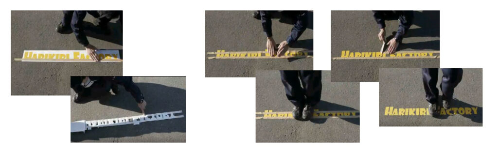 ステッカーをマスキングテープなどで貼って位置決めをした後、裏返して剝離紙を剥がしてしっかり押さえ、そのあと足やゴムハンマーで圧着を繰り返す様子。